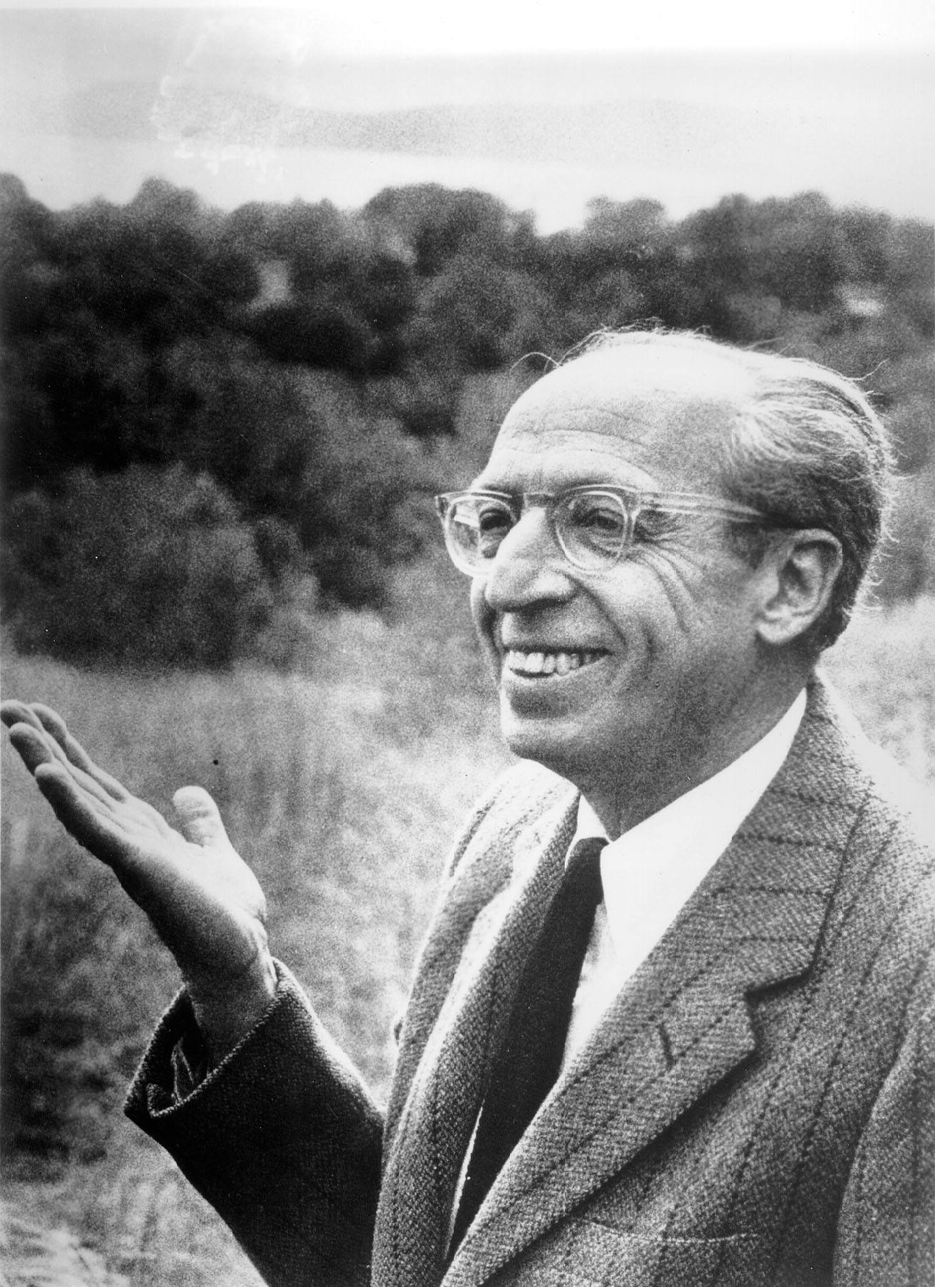 Aaron Copland black and white image with his hand out