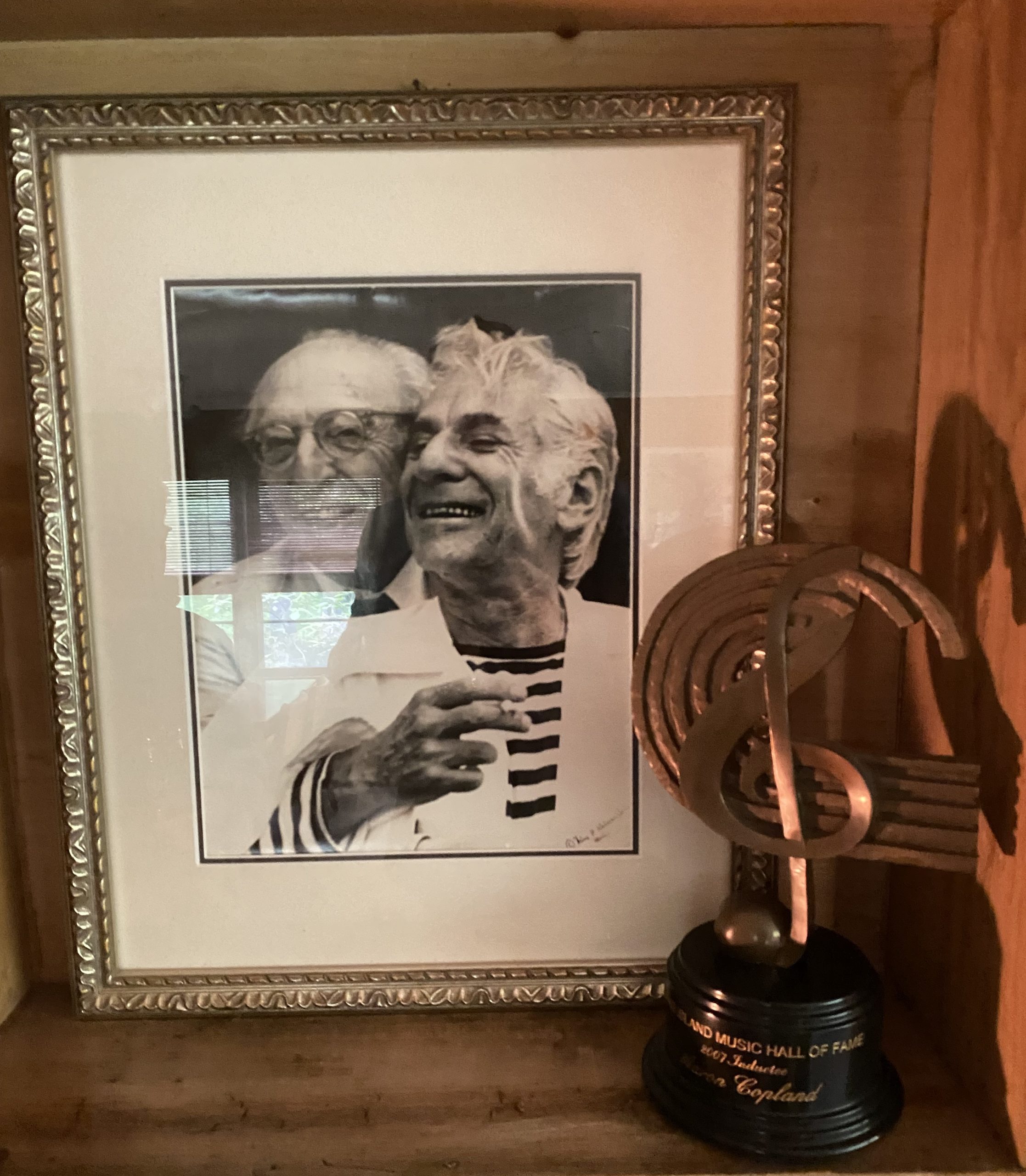 Picture of Aaaron Copland and Leonard Bernstein embracing - framed print at Copland House